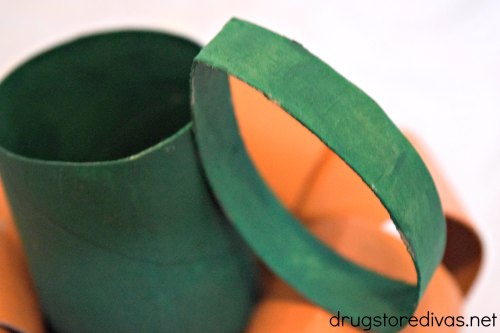 Green toilet paper rolls to look like a stem and leaf.