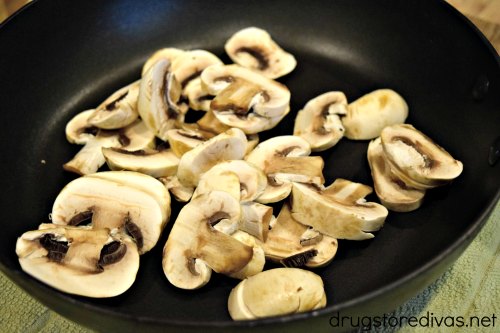 Mushrooms sliced and in a pan.