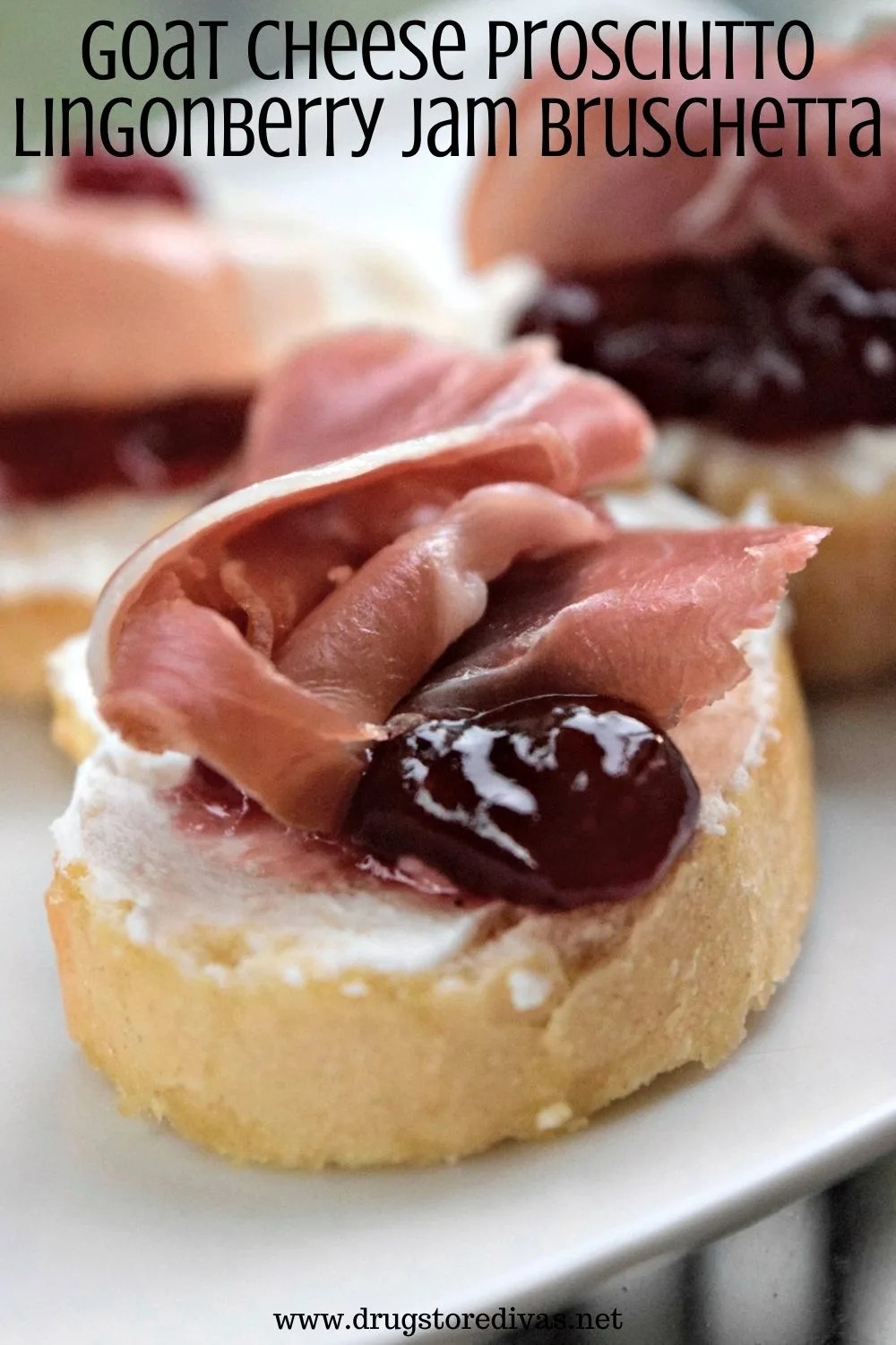 Pieces of Goat Cheese Prosciutto Lingonberry Jam Bruschetta on a plate.