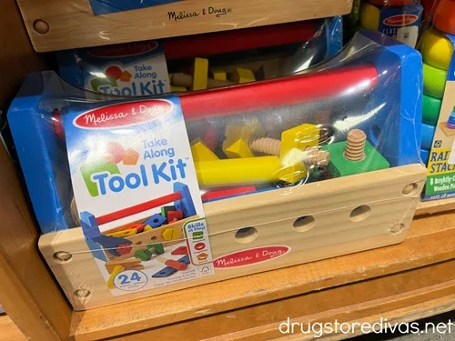 A Melissa And Doug Wooden Tool Box toy on a shelf in a store.