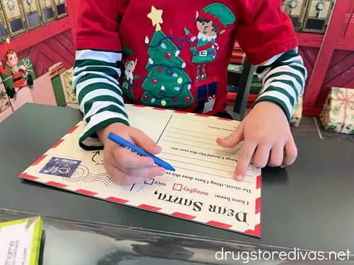 A child writing a letter to Santa.