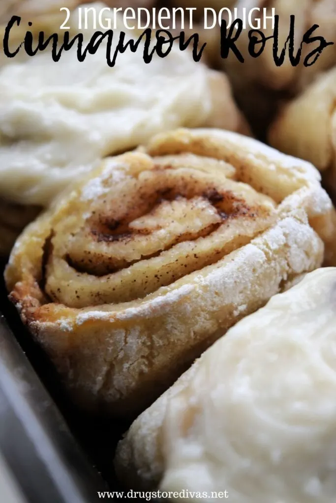 Cinnamon Rolls, some with icing and some without, and the words "2 Ingredient Dough Cinnamon Rolls" digitally written on top.