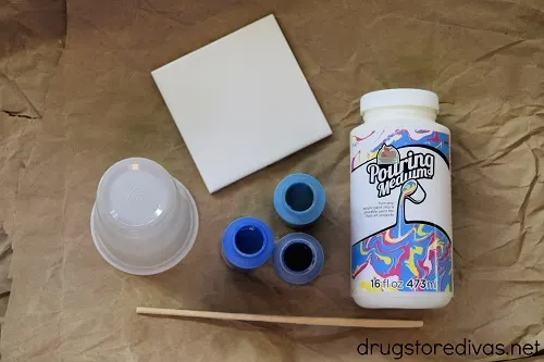 Paint pour coasters are really easy to make at home. Find out how in this Paint Pour Coasters tutorial on www.drugstoredivas.net.