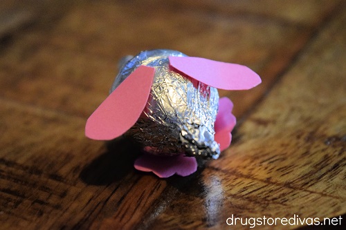 Pink ears and feet glued onto two silver Hershey's Kisses to look like a mouse.