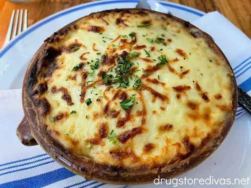 Greek moussaka in a bowl on a table at Kipos in Wilmington, NC.