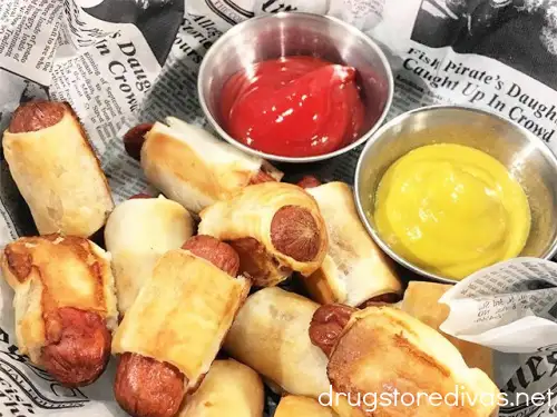 Pigs in a blanket on a tray with ketchup and mustard from Bridgewater Wines in Leland, NC.