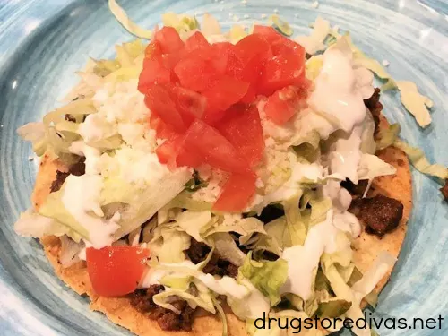 A tostada on a blue plate from Chingon in Leland, NC.