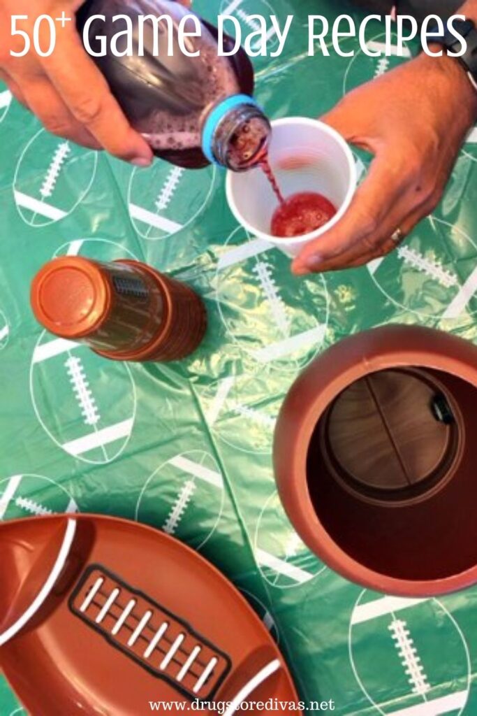 Hands pouring a drink over a football tablecloth with a football chip and dip plate nearby and the words "50+ Game Day Recipes" digitally written on top.