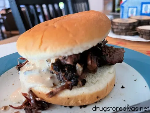 A brisket sandwich from Leland Smokehouse on a blue and white plate.