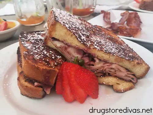 A Monte Cristo sandwich on a plate with strawberries from New Day Cafe in Leland, NC.