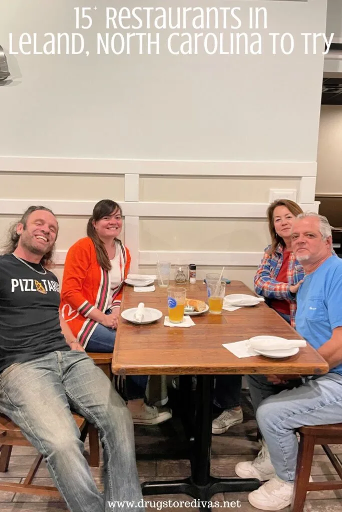 Two couples (two men, two women) sitting at a table in a restaurant with the words "15+ Restaurants In Leland, North Carolina To Try" digitally written above them.