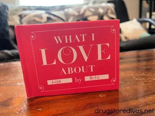 A pink book that says "What I Love About Lisa By Pete" on the cover.