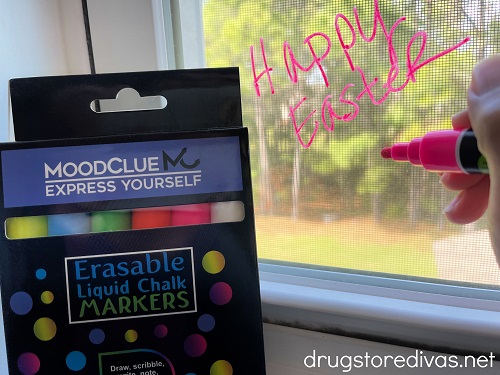 A package of markers next to a window that says "Happy Easter."