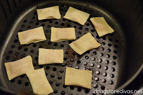 Air Fryer Pizza Rolls are such a simple way to make homemade pizza rolls in minutes. Get the recipe on www.drugstoredivas.net.