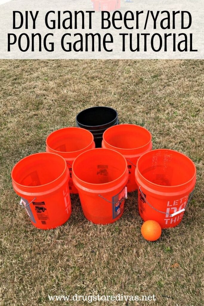 Six 5 gallon buckets set up in a triangle with the words "DIY Giant Beer/Yard Pong Game Tutorial" digitally written on top.