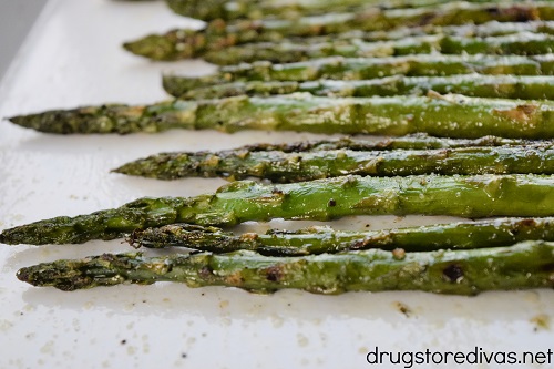 Grilled asparagus on a tray.