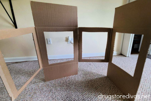 Two cardboard boxes standing and taped together.