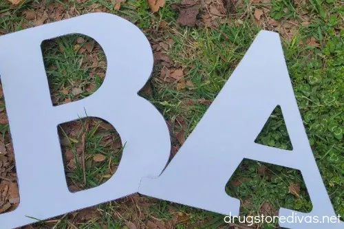 Oversized letters: B and A.