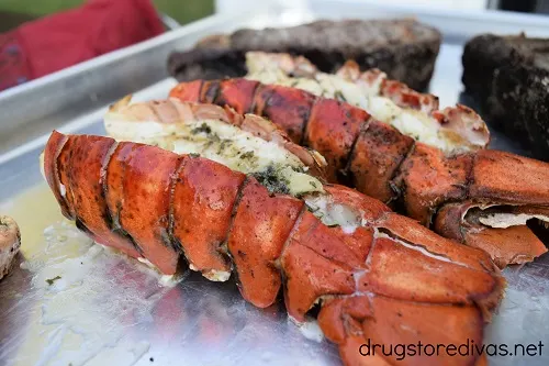 Lobster and steak on a tray.