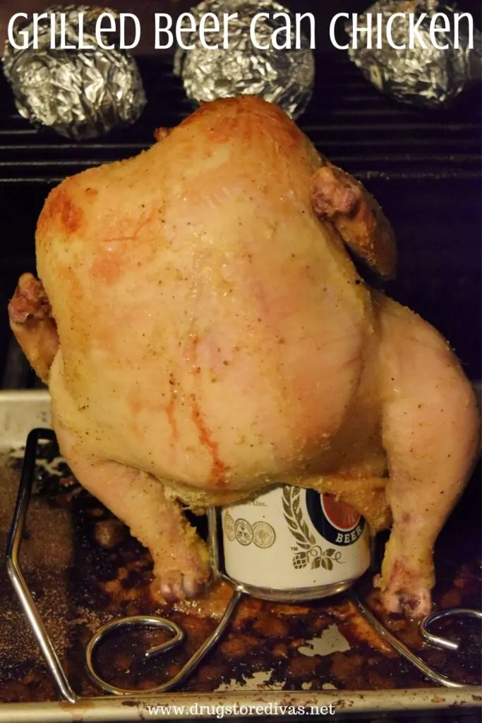A beer can chicken on a grill.