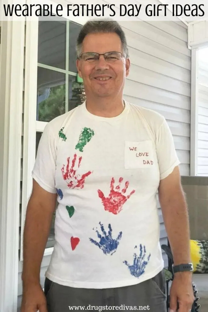 A man wearing a homemade Father's Day shirt with the words "Wearable Father's Day Gift Ideas" digitally written on top.