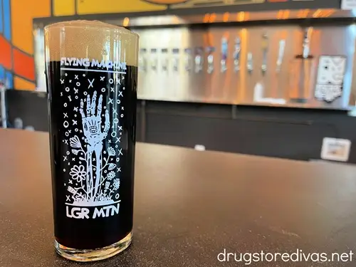 A mug full of a dark beer from Flying Machine Brewing in Wilmington, NC.