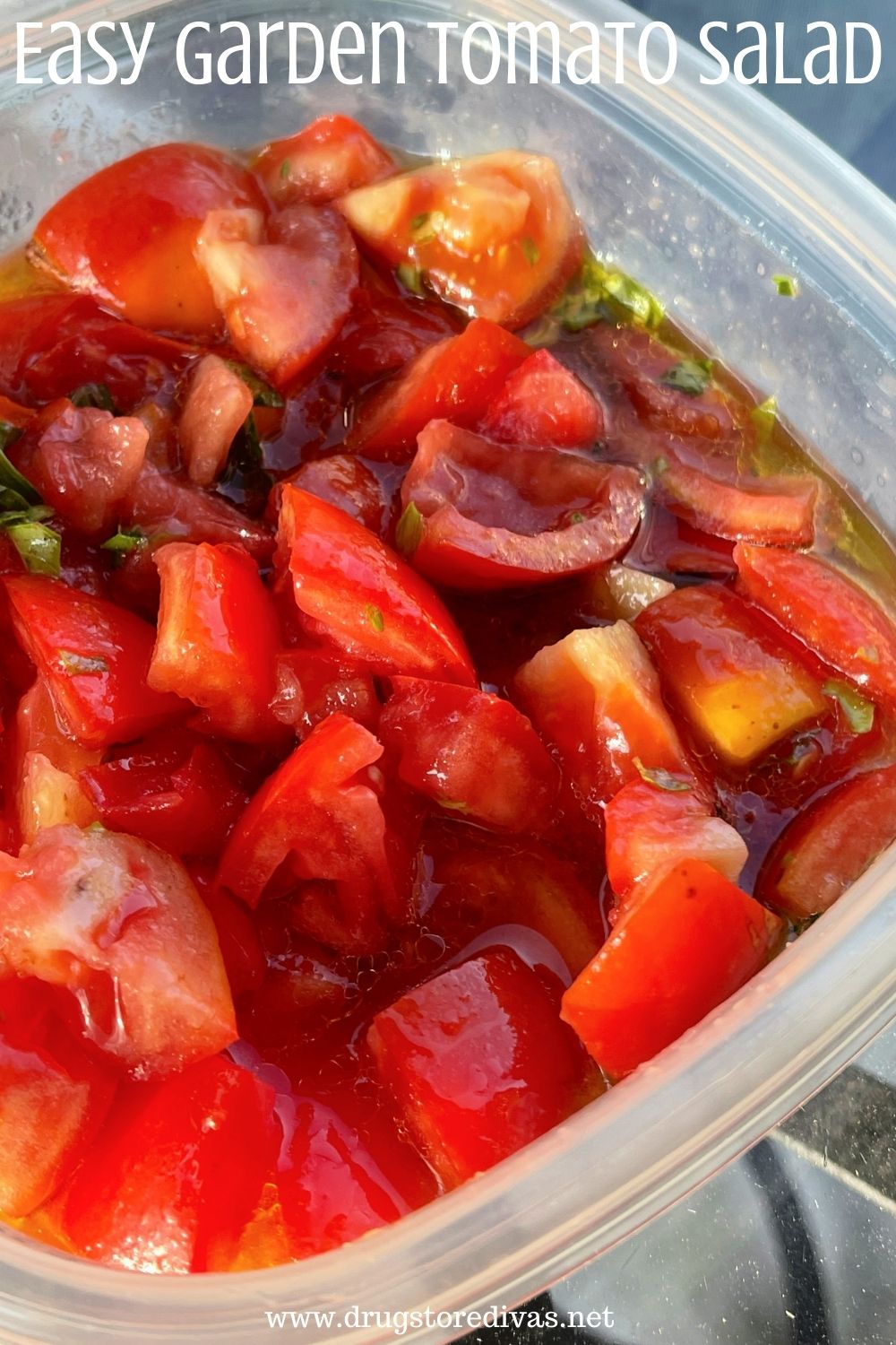 Garden Tomato Salad in a plastic container with the words "Easy Garden Tomato Salad" digitally written above it.