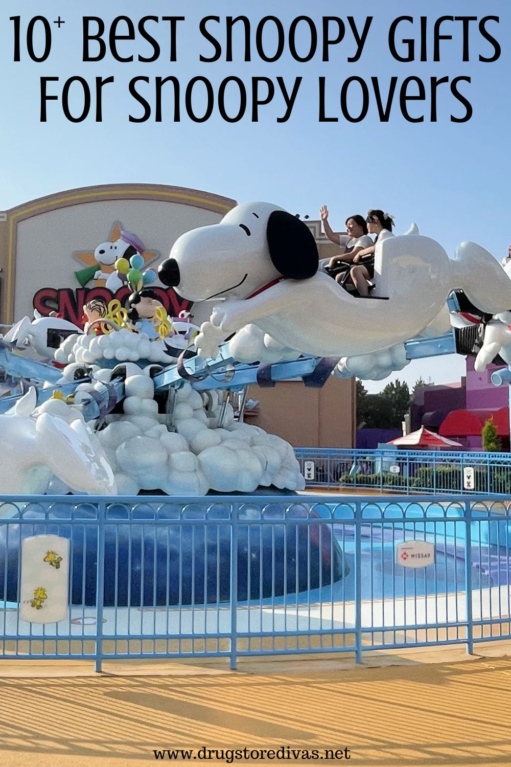 People on a Snoopy ride at Universal Studios Japan with the words 