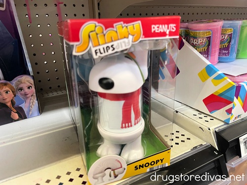 A Snoopy Slinky on a shelf.