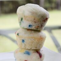 Three stacked mini funfetti muffins with the words 