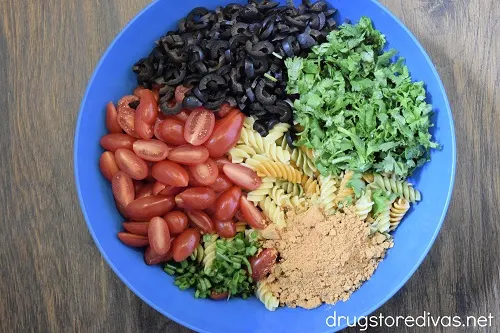 This Taco Pasta Salad is accidentally vegan, incredibly simple to make, has all the flavors of tacos, and is a mayo-free pasta salad.