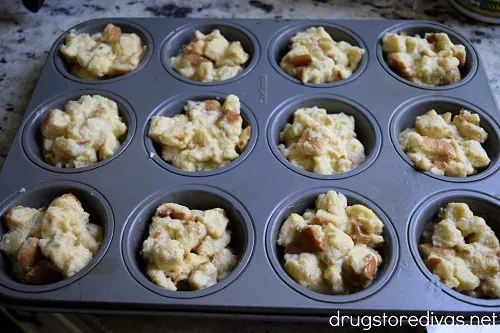 Bread pudding muffin ingredients in a muffin pan.