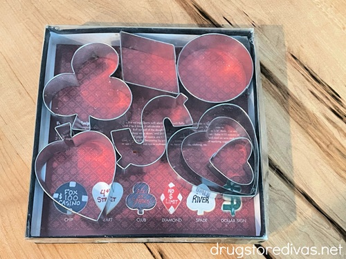 A box filled with playing card suit cookie cutters.