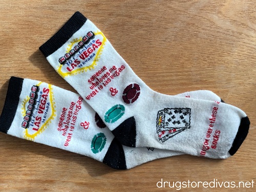 A pair of socks from Las Vegas with poker chips and playing cards on them.