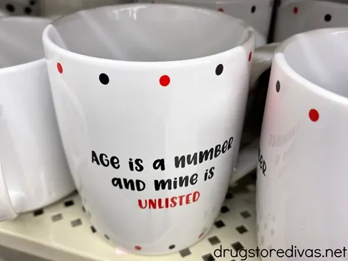 A mug that says Age Is  A Number And Mine Is Unlisted on it.