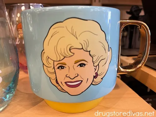 A blue mug with Betty White's face on it.