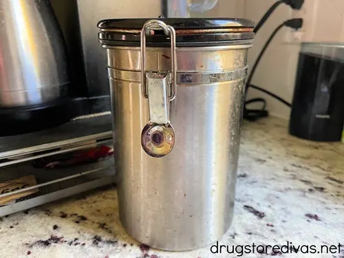 Have a coffee drinker on your shopping list? Check out these Top 10 Gifts For Coffee Lovers on www.drugstoredivas.net. A silver coffee canister next to a coffee pot on a counter.