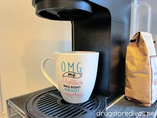 A white mug that says OMG My Mother Was Right About Everything on it.