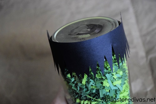 Black cardstock bangs glued to the top of a mason jar.