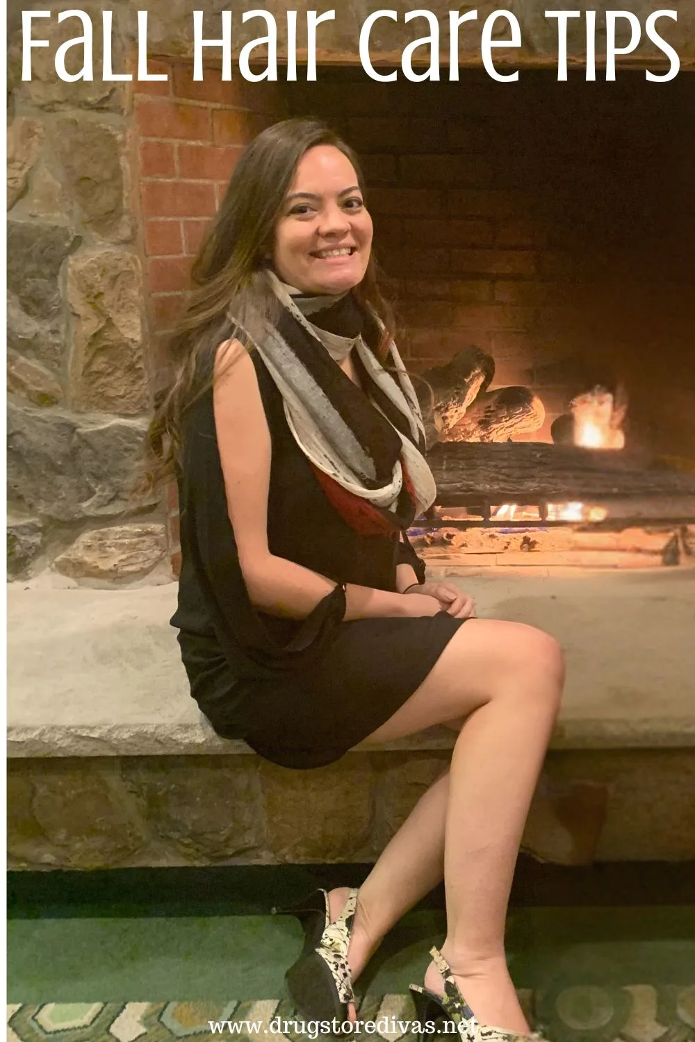 A woman in a black dress wearing a scarf and sitting in front of a fireplace with the words 