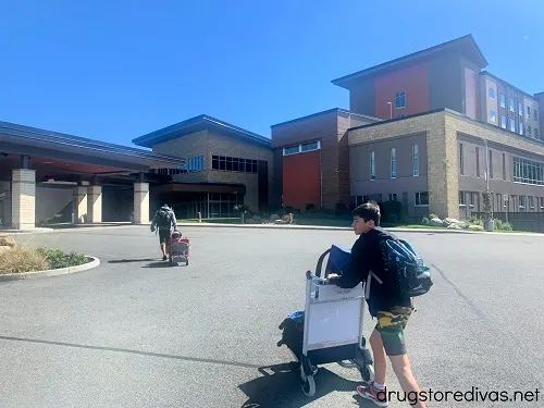 A family pushing luggage into The Kartrite Resort.