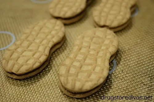 Nutter Butter cookies on a silicone baking mat.