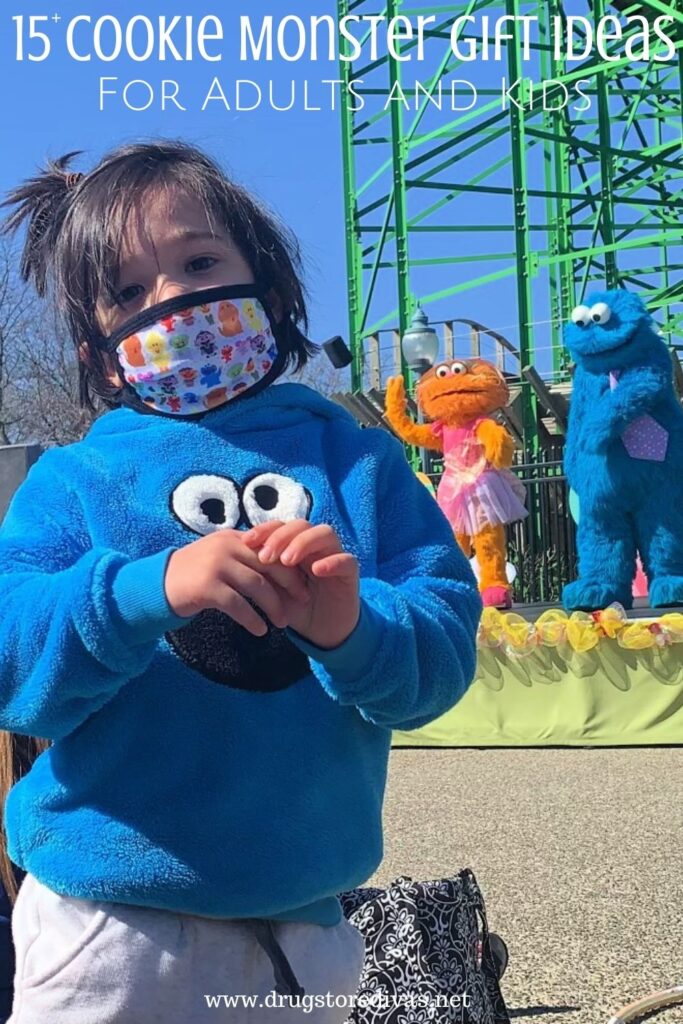 Kid in a Cookie Monster sweatshirt and mask with Cookie Monster and another muppet behind him with the words "15+ Cookie Monster Gifts For Adults And Kids" digitally written above him.