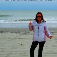 A woman in a coat on the beach with the words 