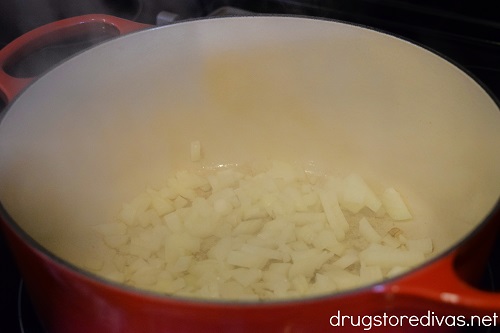 Diced onion in a Dutch oven.