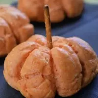 Bagels shaped to look like pumpkins with the words