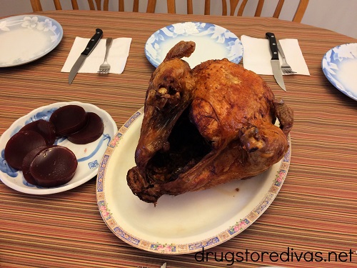 Deep fried turkey and cranberry sauce on a table.
