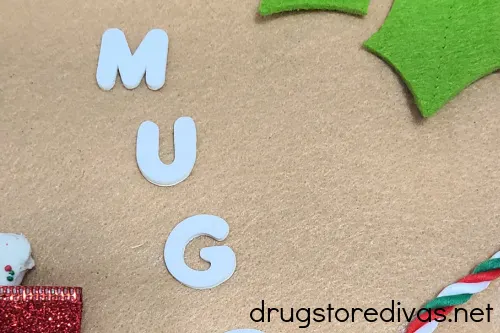 Letters spelling out the word MUG on a DIY Dog Treat Advent Calendar.