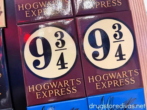 Two brown magnets with a white circle and the number 9 3/4 in them and Hogwarts Express written under them.