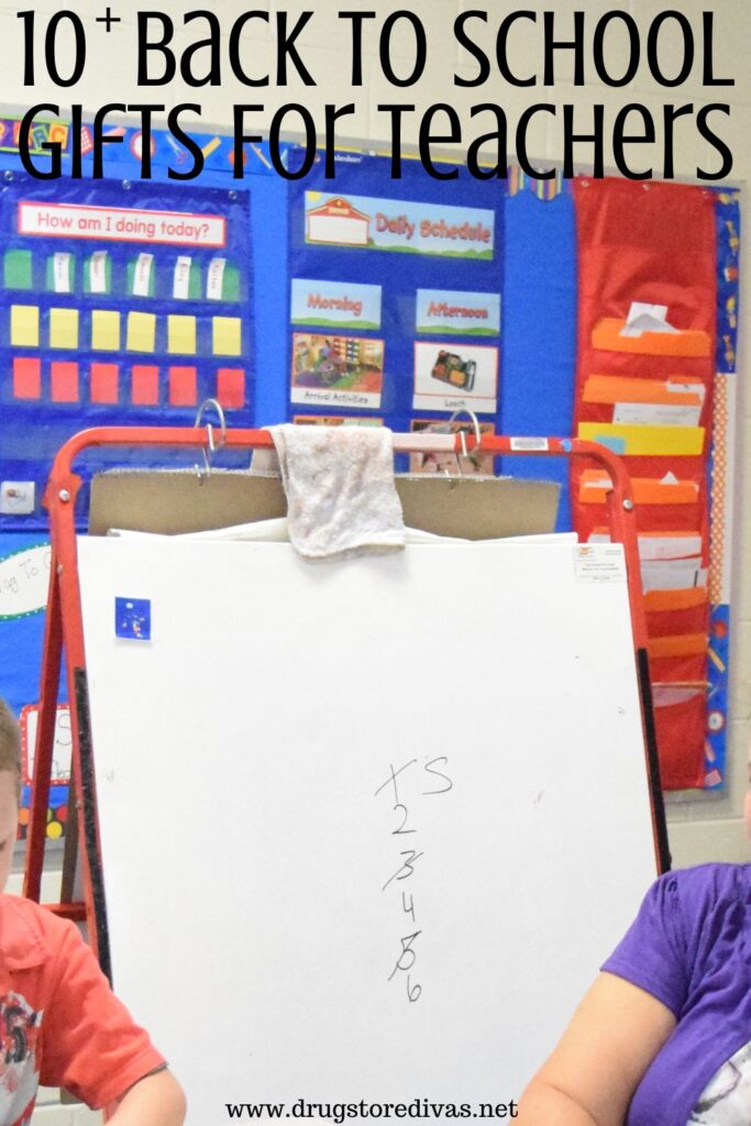 Photo of a dry erase easel in a classroom with the words "10+ Back To School Gifts For Teachers" digitally written on top.